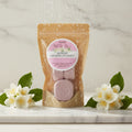 Azriel Jasmine Shower Steamer packaging on a cardboard background