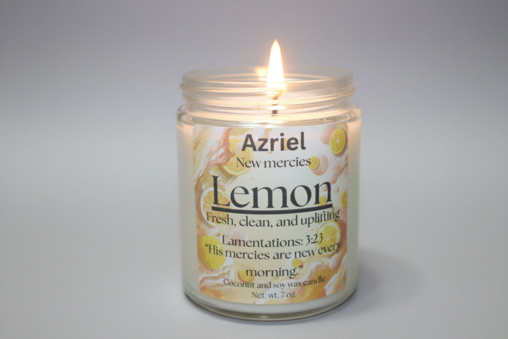Candle in a jar labeled 'Azriel Lemon' with a flame against a neutral background
