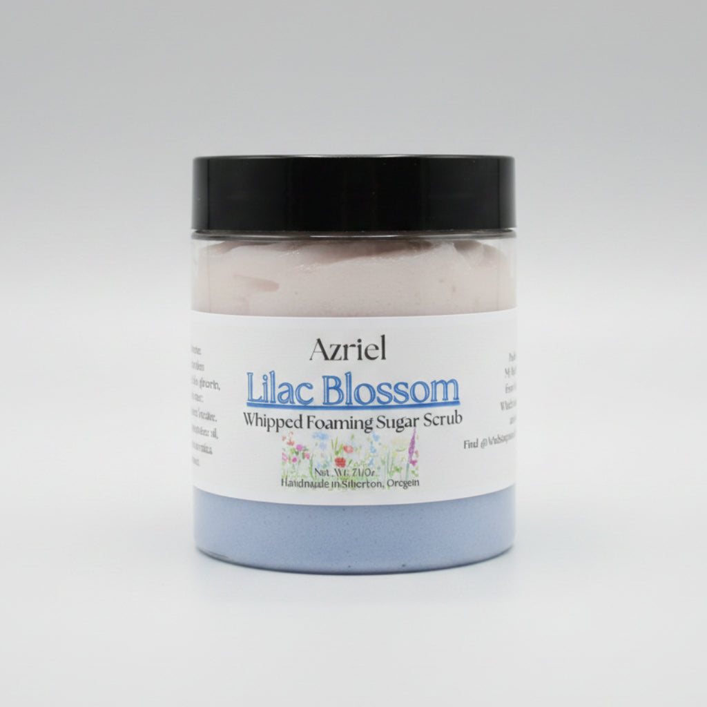 Jar of Azriel Lilac Blossom Whipped Foaming Sugar Scrub on a brown background