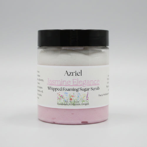 Jar of Azriel Jasmine Elegance Whipped Foaming Sugar Scrub on a beige background