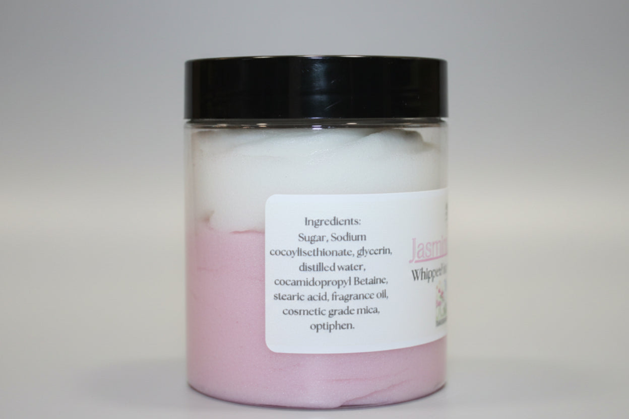 Jar of pink bath product with black lid on a beige background