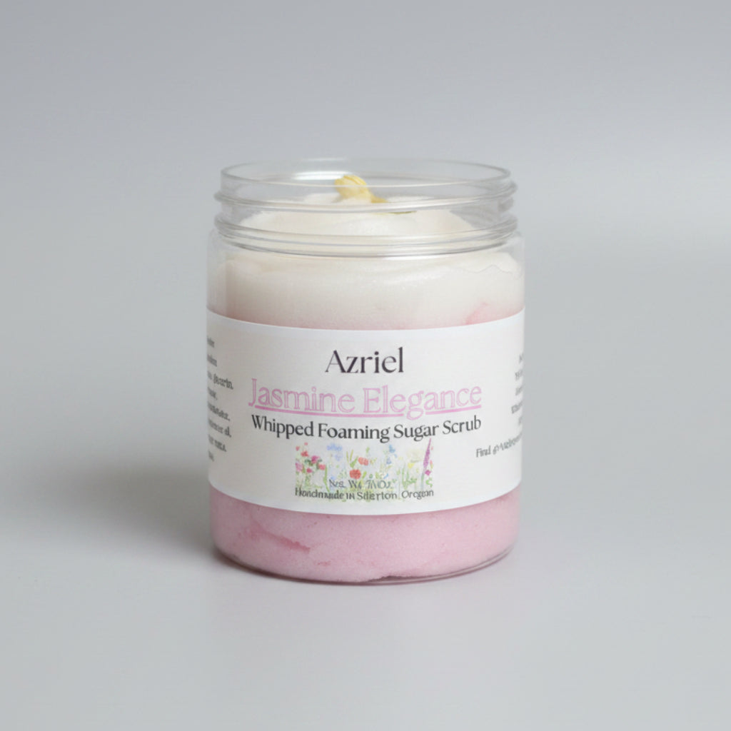 Jar of Azriel Jasmine Elegance Whipped Foaming Sugar Scrub on a cardboard background