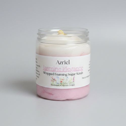 Jar of Azriel Jasmine Elegance Whipped Foaming Sugar Scrub on a cardboard background