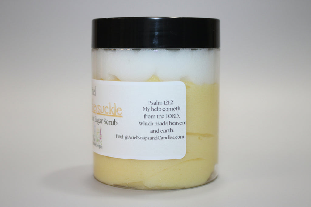Jar of sugar scrub with a black lid on a beige surface