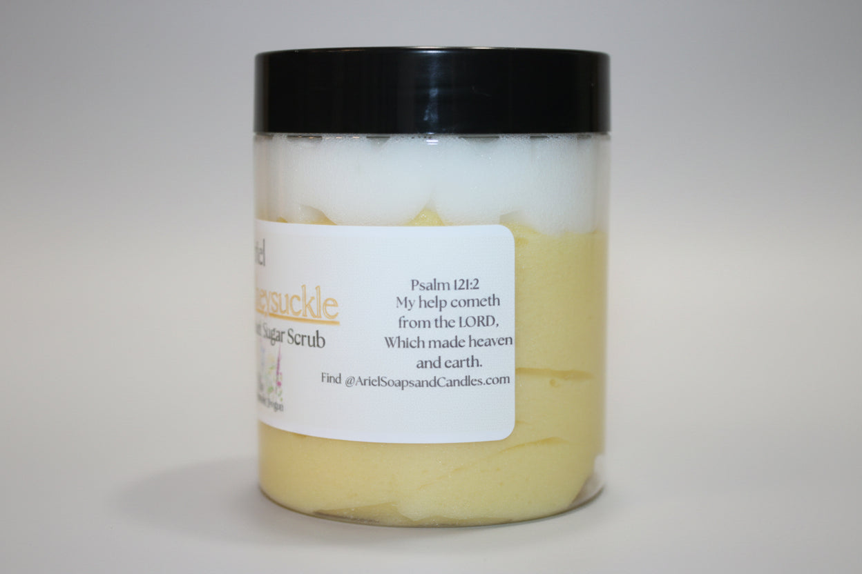 Jar of sugar scrub with a black lid on a beige surface