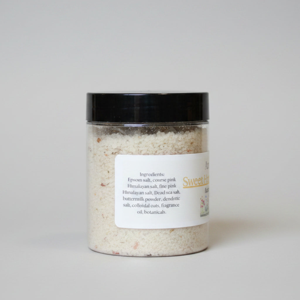 Jar of bath salt with a label on a neutral background