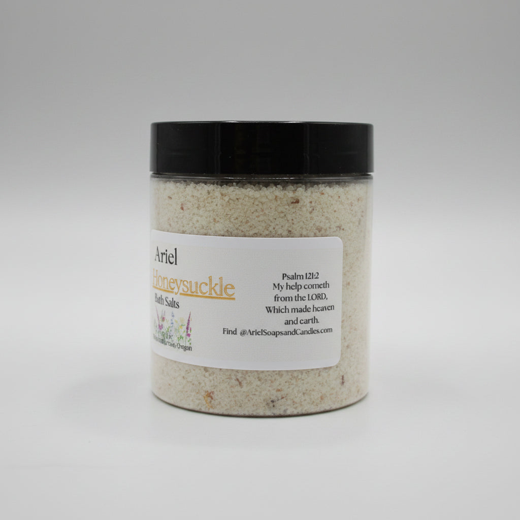 Jar of bath salts with a black lid and label on a beige surface
