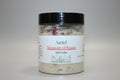 Jar of Azriel Bouquet of Roses Bath Salts on a textured surface