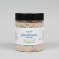 Jar of Azriel Lilac Blossom Bath Salts on a beige surface with a neutral background