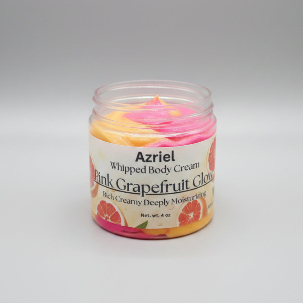 Jar of Azriel Whipped Body Cream with pink grapefruit flavor on a beige background