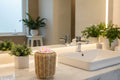 Wicker basket with pink flower-shaped objects on a neutral background