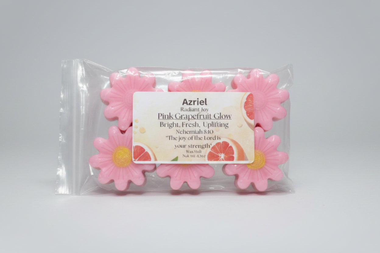 Pink grapefruit-scented wax melts in packaging with a label on a cardboard background