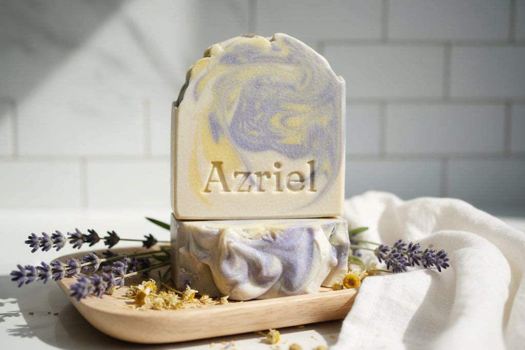 Decorative soap bar with 'Azriel' branding on a wooden surface