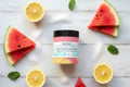 Jar of Azriel Watermelon Lemonade foaming whipped sugar scrub on a cardboard background