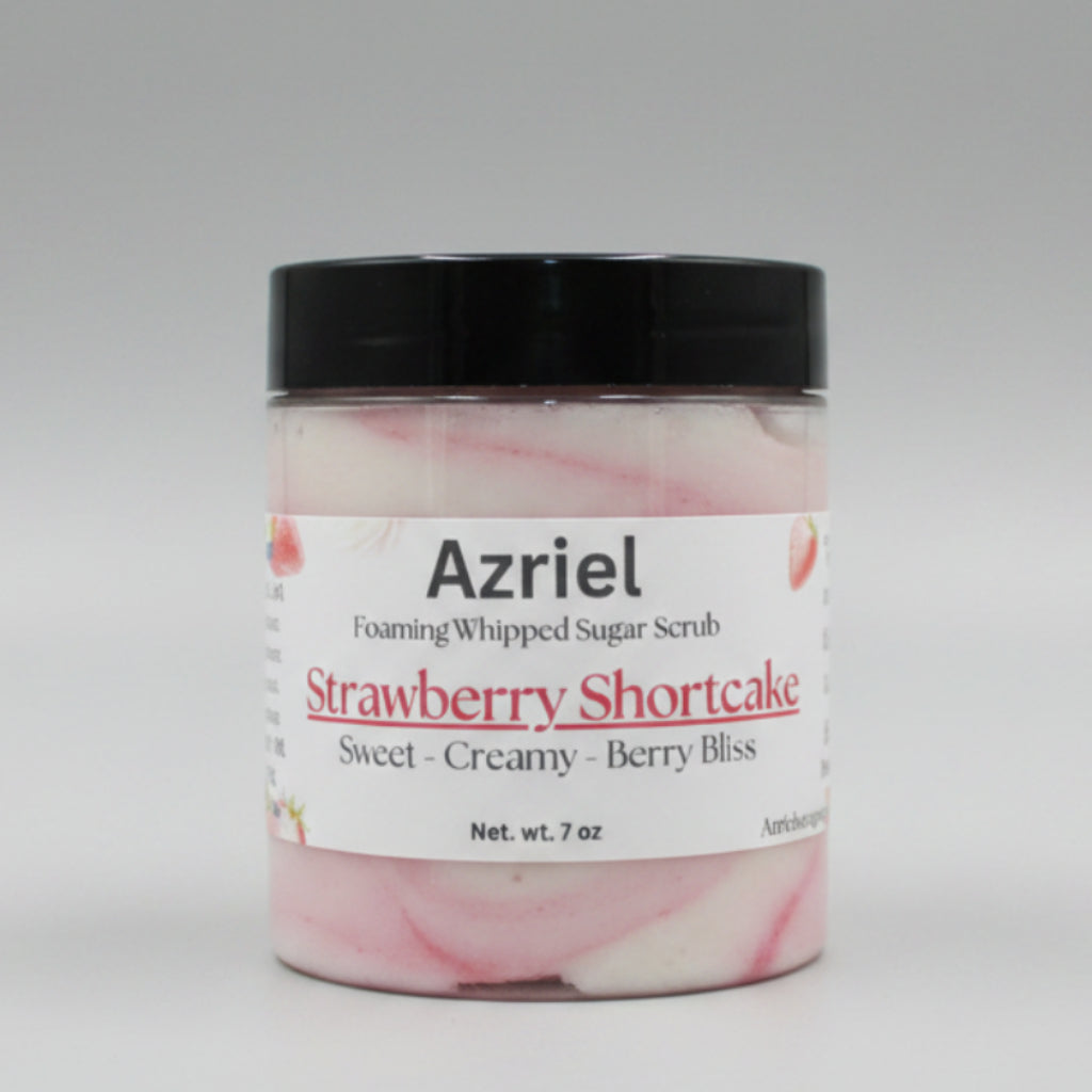 Jar of Azriel Strawberry Shortcake foaming whipped sugar scrub on a wooden surface