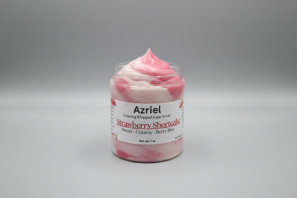 Jar of Azriel Strawberry Shortcake foaming whipped sugar scrub on a beige surface