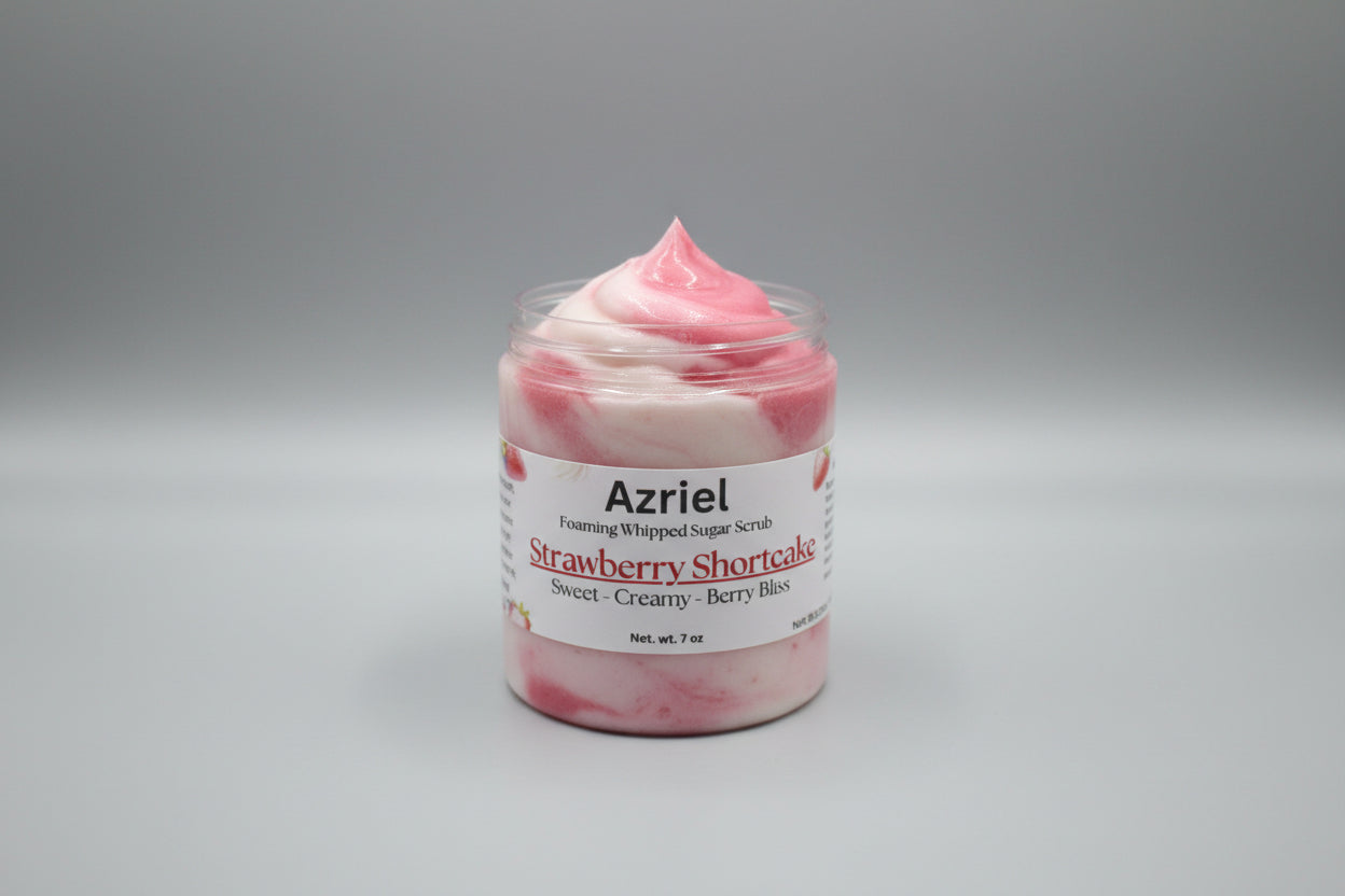 Jar of Azriel Strawberry Shortcake foaming whipped sugar scrub on a beige surface