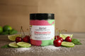 Jar of Azriel Cherry Lime Fizz Foaming Whipped Sugar Scrub on a brown background