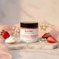 Jar of Azriel Strawberry Shortcake whipped body cream on a brown background
