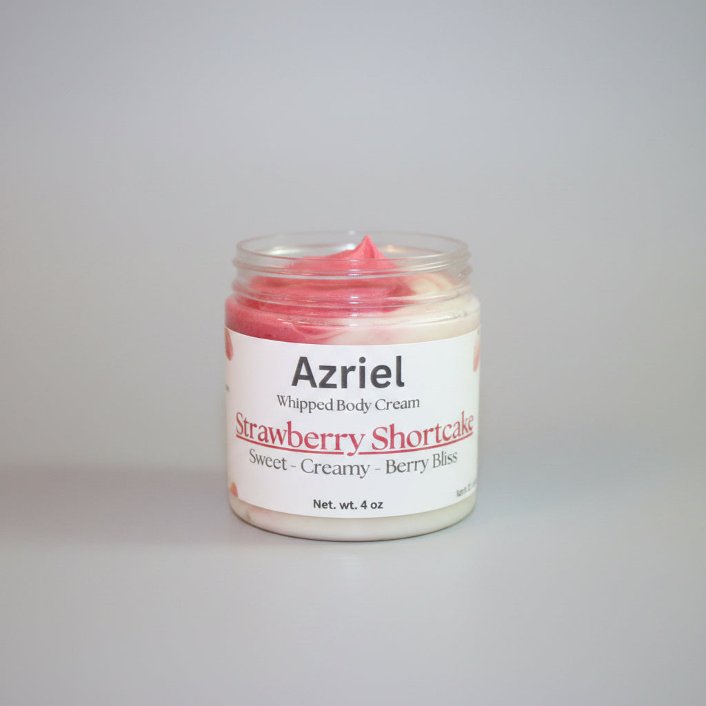 Jar of Azriel Strawberry Shortcake whipped body cream on a brown background