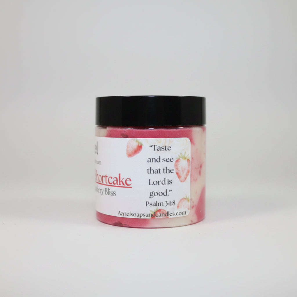 Jar of strawberry shortcake candle with a label on a brown background
