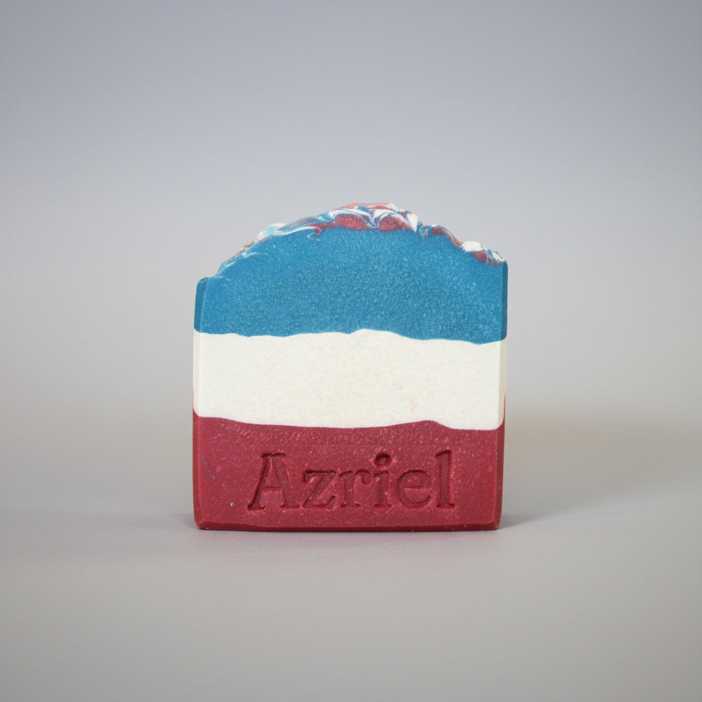 Bar of soap with blue, white, and red stripes on a brown background